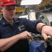 USS Dewey (DDG 105) Sailors Conduct Routine Operations in the Ship's General Workshop