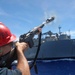 USS Dewey (DDG 105) Conducts Underway Replenishment with USNS Wally Schirra (T-AKE 8) While Operating in the Philippine Sea