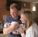 Lt. Nathan Henderson (left) with wife Claire and newborn baby Everett