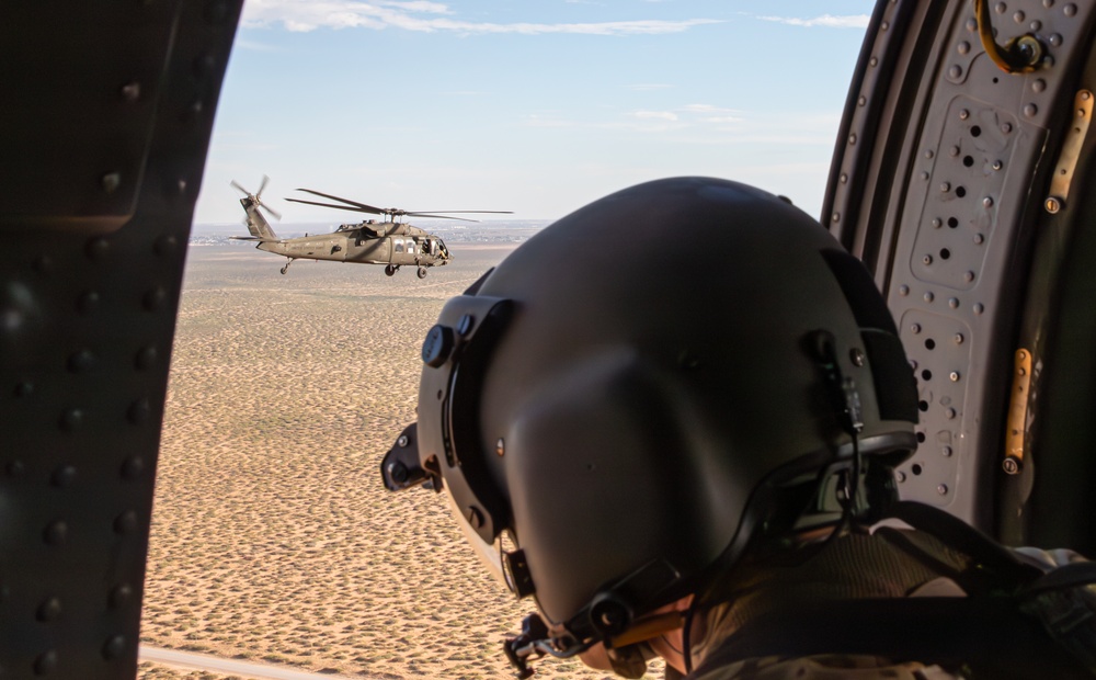 U.S. Army Door Gunner scans the dessert