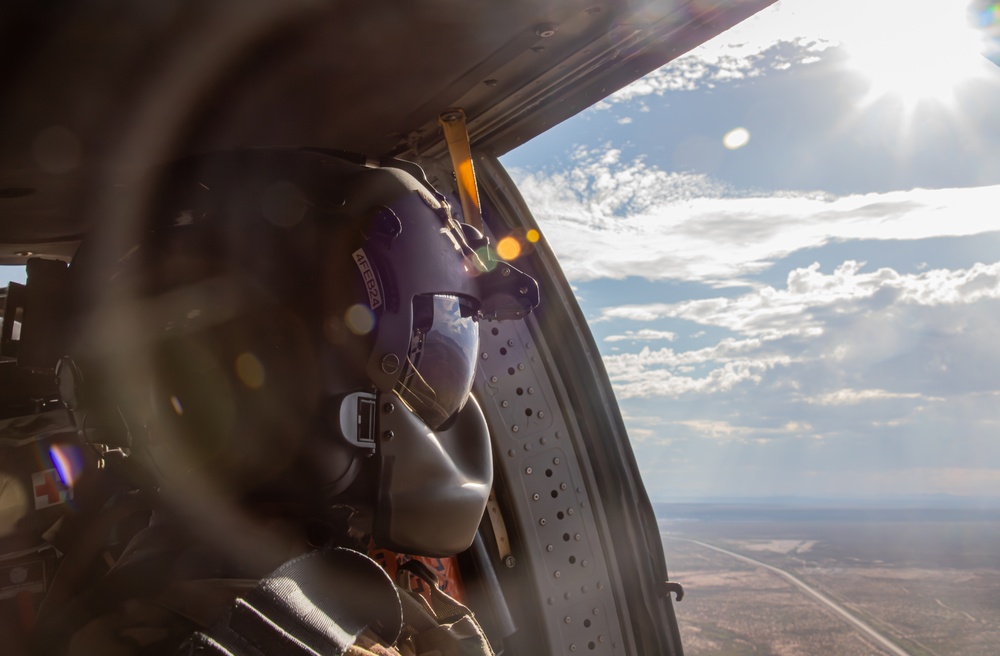 U.S. Army Crew Chief scans the horizon