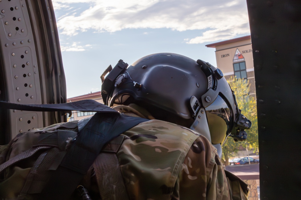 U.S. Army Crew Chief scans a landing zone