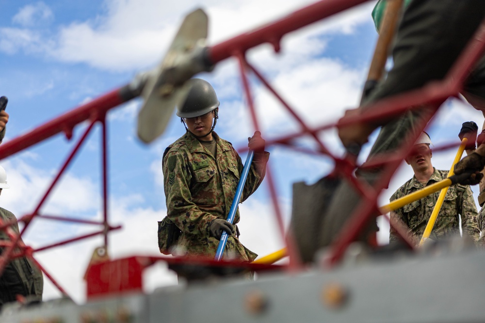 Cemented in Time - Japan Ground Self-Defense Force, U.S. Marines, and Sailors prepare Kirishima Training Area for airfield damage repair training