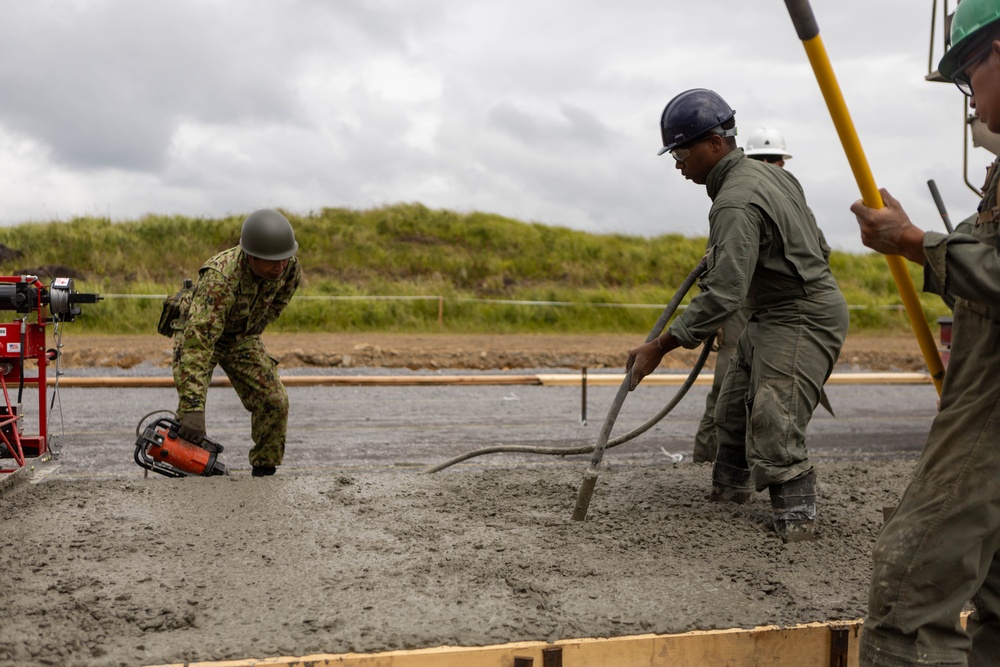 Cemented in Time - Japan Ground Self-Defense Force, U.S. Marines, and Sailors prepare Kirishima Training Area for airfield damage repair training