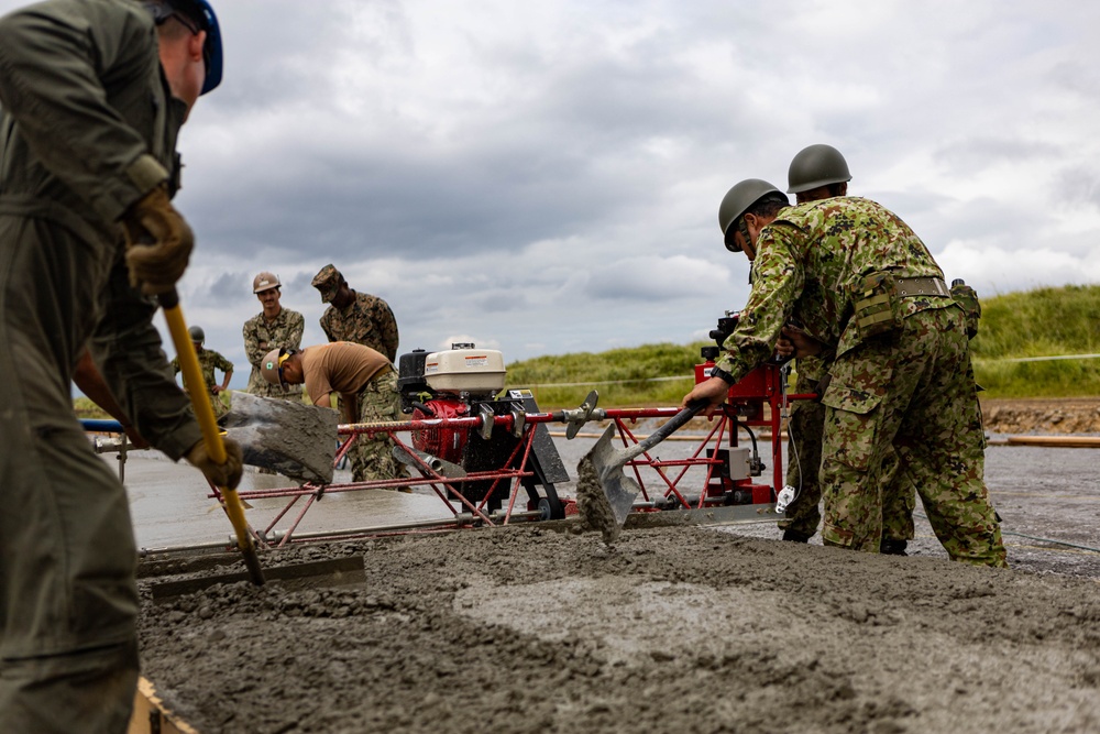 Cemented in Time - Japan Ground Self-Defense Force, U.S. Marines, and Sailors prepare Kirishima Training Area for airfield damage repair training