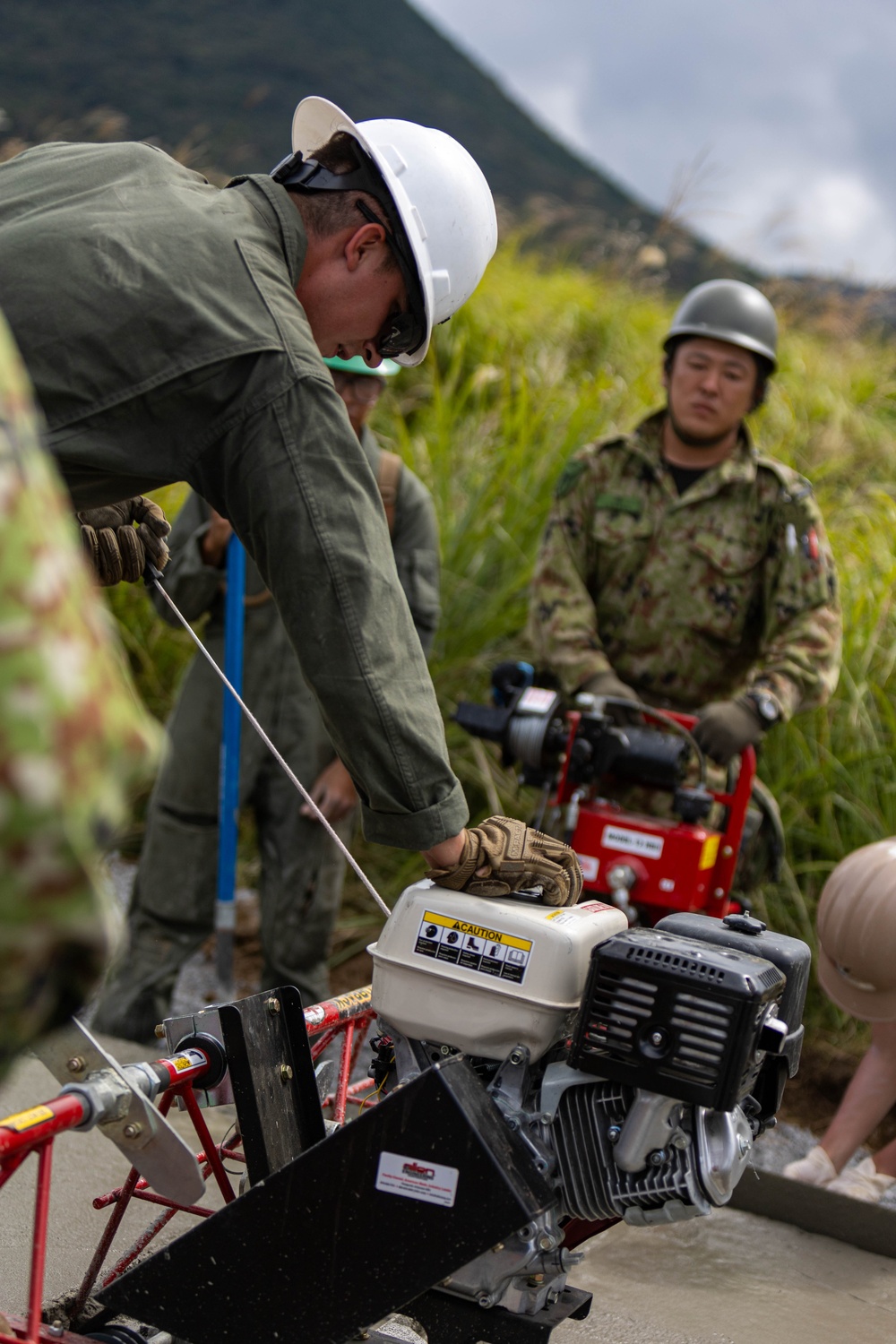 Cemented in Time - Japan Ground Self-Defense Force, U.S. Marines, and Sailors prepare Kirishima Training Area for airfield damage repair training