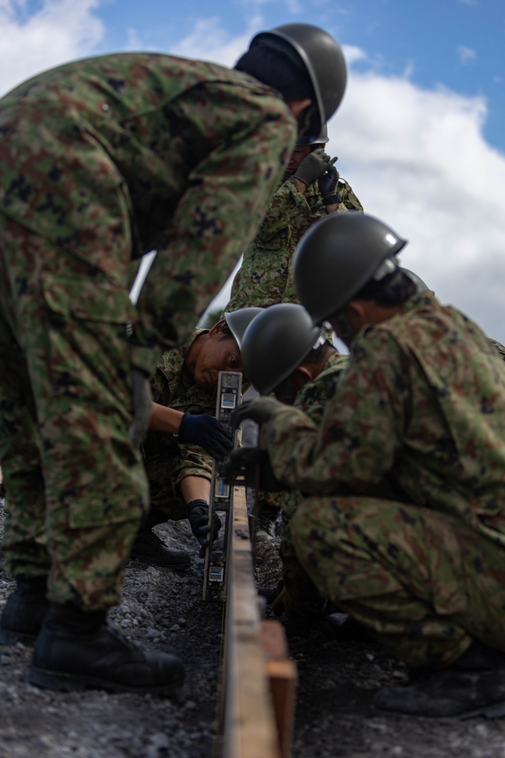 Better Together - Japan Ground Self-Defense Force, U.S. Marines, and Sailors prepare Kirishima Training Area for airfield damage repair training