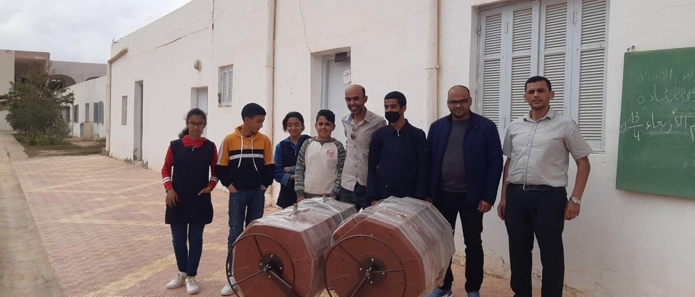 Students explore the inner workings of the compost machine with Bir Lahmer Municipality engineers