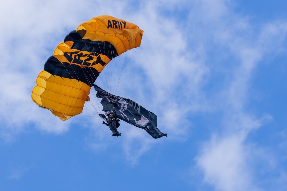 Soldiers from Army Golden Knights jump in San Diego onto U.S.S. Midway