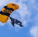 Soldiers from Army Golden Knights jump in San Diego onto U.S.S. Midway