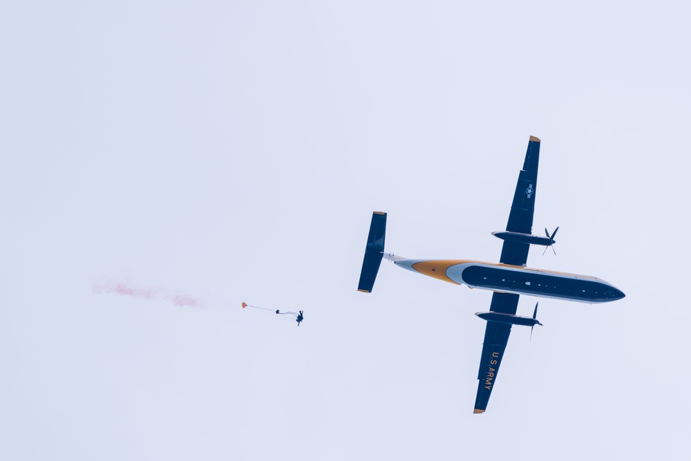 Soldiers from Army Golden Knights jump in San Diego onto U.S.S. Midway