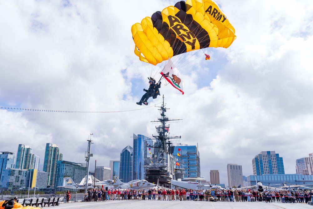 Soldiers from Army Golden Knights jump in San Diego onto U.S.S. Midway