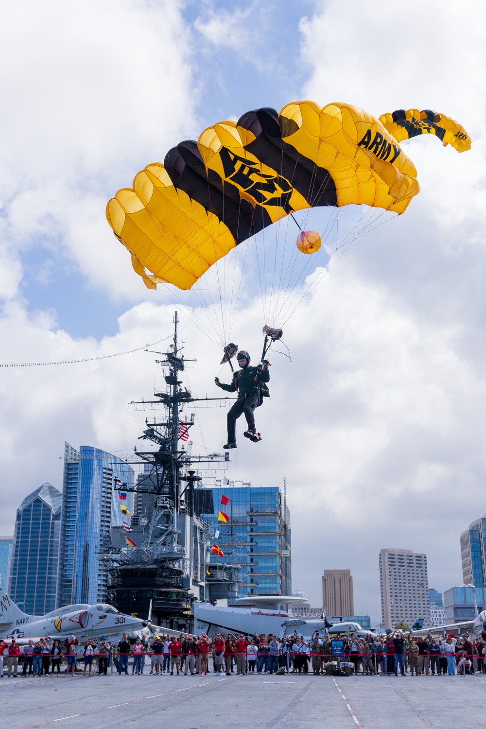 Soldiers from Army Golden Knights jump in San Diego onto U.S.S. Midway