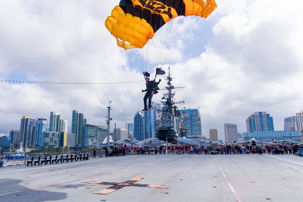 Soldiers from Army Golden Knights jump in San Diego onto U.S.S. Midway