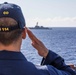 USS Rafael Peralta steams past the USS Ralph Johnson in the South China Sea.