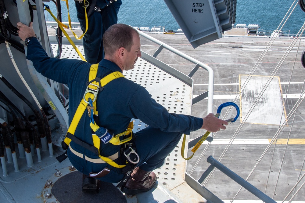 USS Ronald Reagan (CVN 76) Sailors conduct maintenance while working aloft