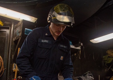 USS Ronald Reagan (CVN 76) Sailor braises piping