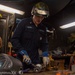 USS Ronald Reagan (CVN 76) Sailor braises piping