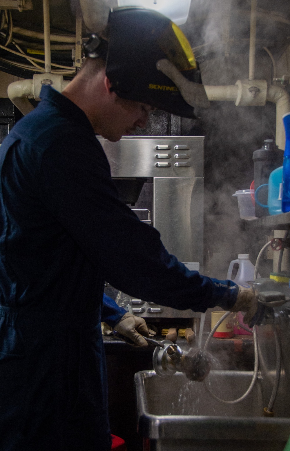 USS Ronald Reagan (CVN 76) Sailor braises piping
