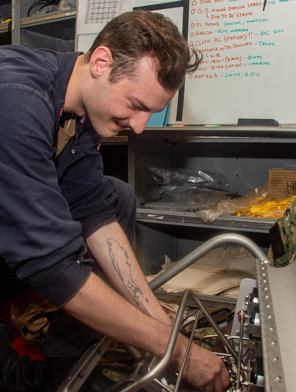 Ronald Reagan (CVN 76) Sailors repair self-contained breathing apparatus recharger