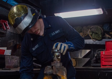 USS Ronald Reagan (CVN 76) Sailor braises piping