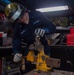USS Ronald Reagan (CVN 76) Sailor braises piping