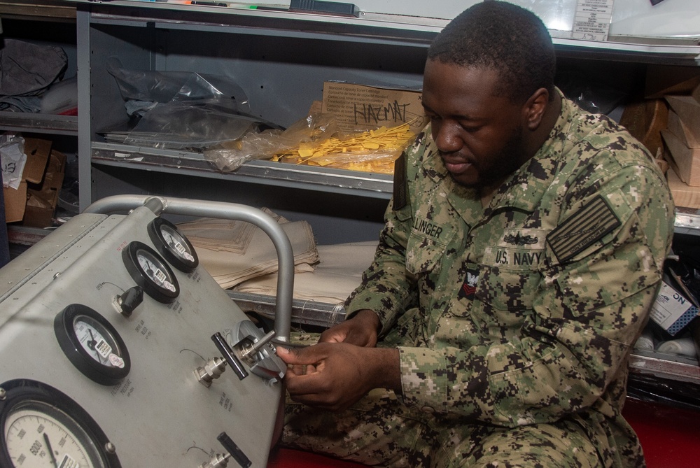 Ronald Reagan (CVN 76) Sailors repair self-contained breathing apparatus recharger