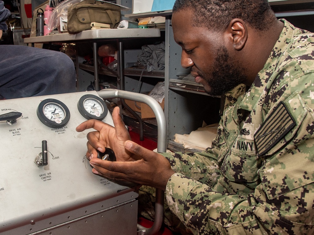 Ronald Reagan (CVN 76) Sailors repair self-contained breathing apparatus recharger
