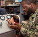 Ronald Reagan (CVN 76) Sailors repair self-contained breathing apparatus recharger