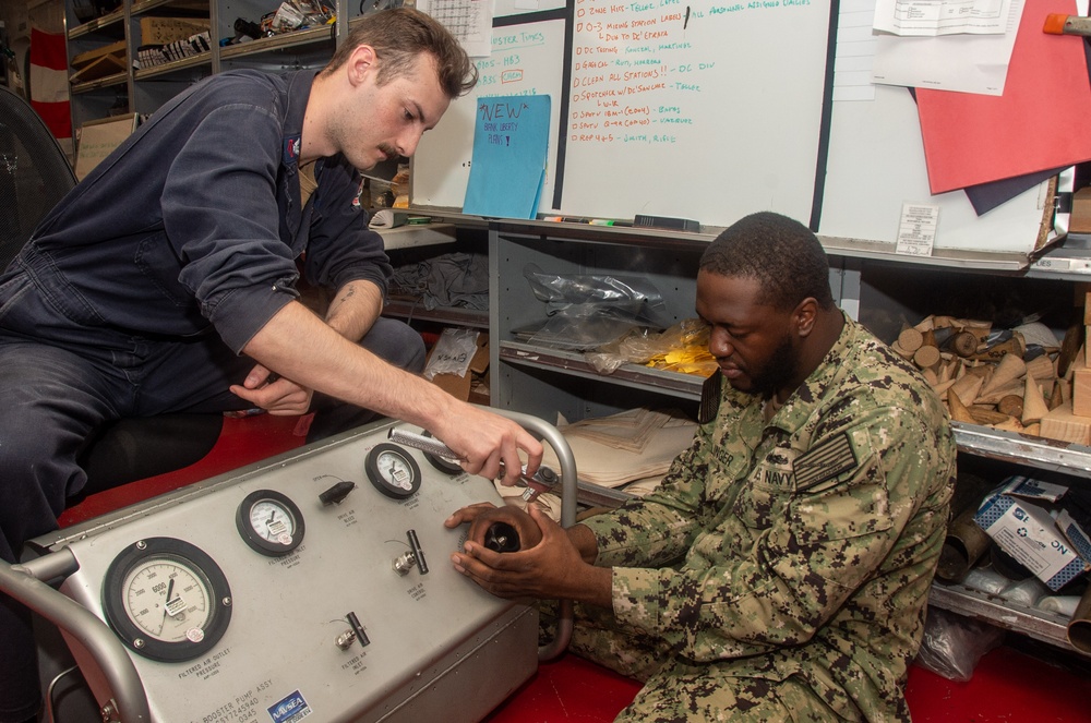 Ronald Reagan (CVN 76) Sailors repair self-contained breathing apparatus recharger