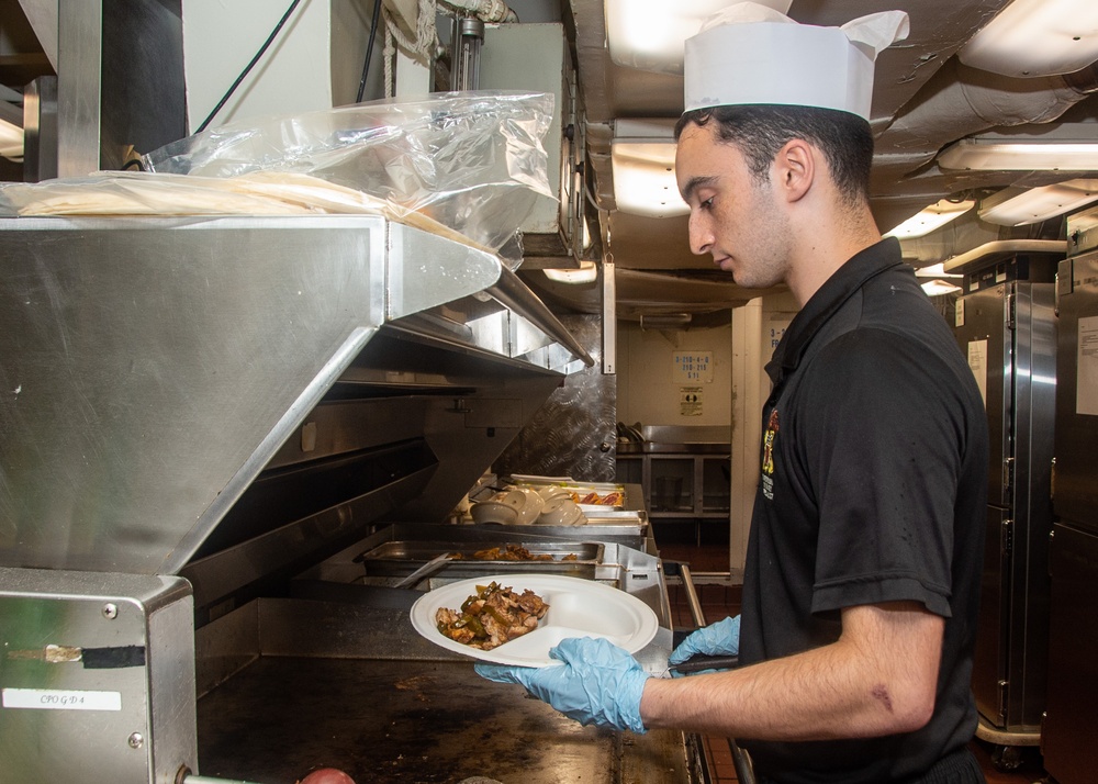 Ronald Reagan (CVN 76) Sailors prepare food in chiefs mess galley