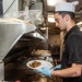 Ronald Reagan (CVN 76) Sailors prepare food in chiefs mess galley