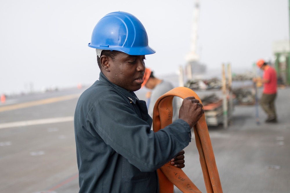 USS Tripoli Sailors Perform Flight Deck Maintenance