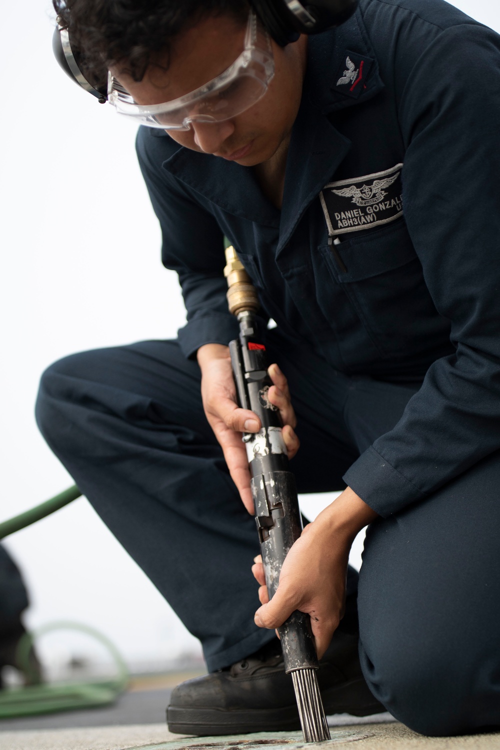 USS Tripoli Sailors Perform Flight Deck Maintenance