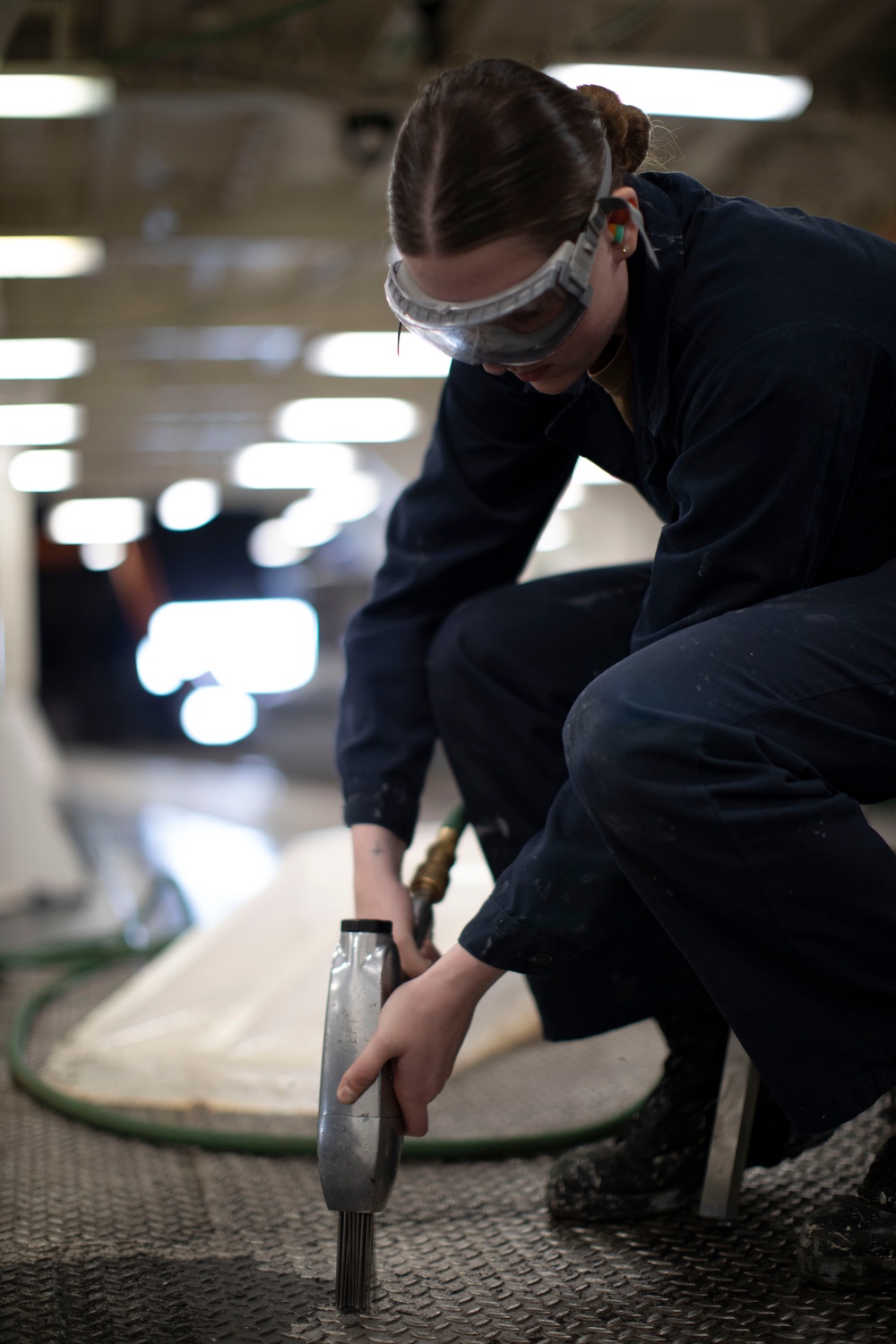 USS Tripoli Sailors Perform Maintenance