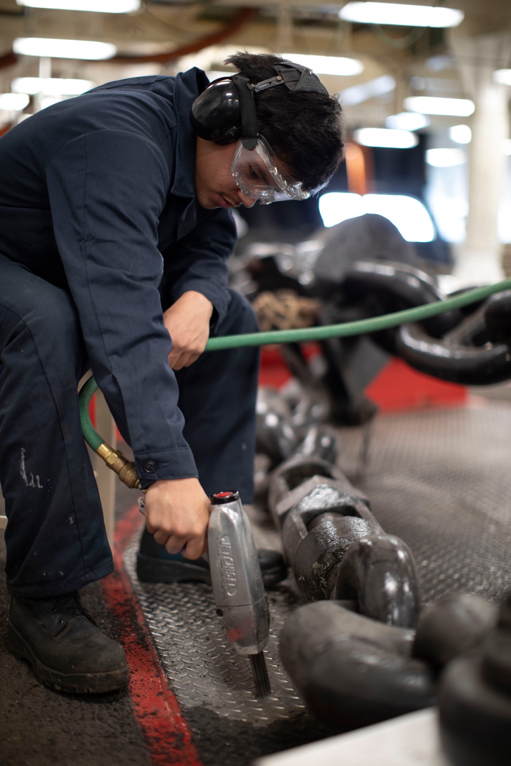 USS Tripoli Sailors Perform Maintenance