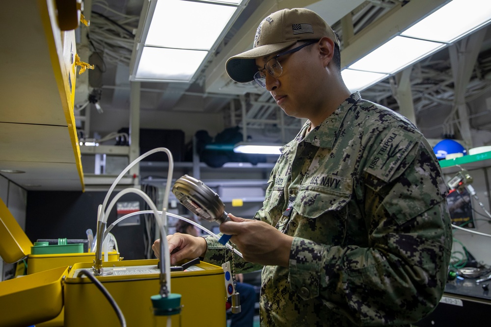 USS Tripoli Sailors Perform Calibration Tests