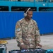 U.S. Air Force Staff Sgt. Stephon Wright, First Term Airman Course/Professional Development noncommissioned officer in charge and a ground transportation support supervisor, plays music for the Air Force Bash at Hangar 3