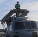 Aviation Electrician’s Mate Petty Officer 2nd Class Austin Goodrich conducts routine maintenance on a Sea Hawk helicopter (MH-60R) aboard the USS Rafael Peralta (DDG 115)