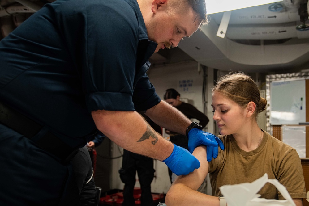 USS Ronald Reagan (CVN 76) Sailors administer flu shots