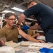 USS Ronald Reagan (CVN 76) Sailors administer flu shots