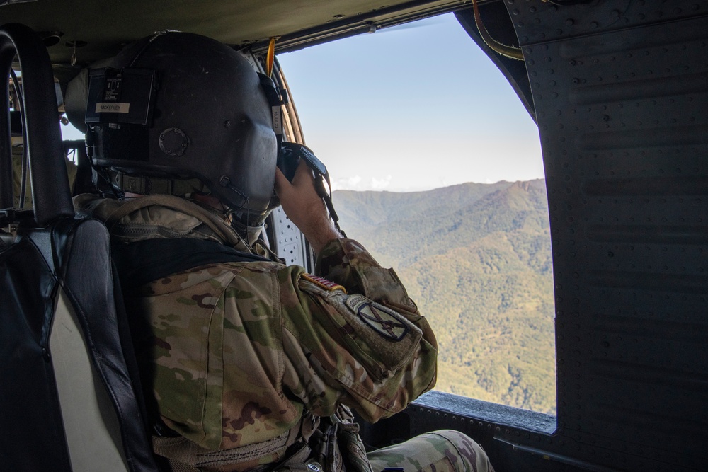 U.S. Army Soldier Photographs Area from UH-60 Black Hawk