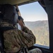 U.S. Army Soldier Photographs Area from UH-60 Black Hawk