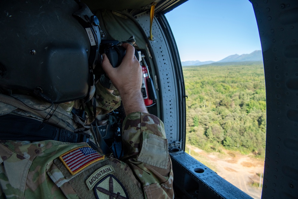 U.S. Army Soldier Photographs Area from UH-60 Black Hawk