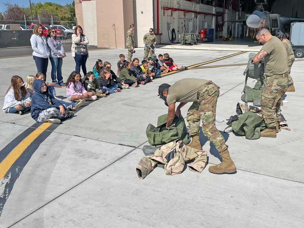 173rd Fighter Wing Airmen demonstrate donning chemical warfare protective gear.