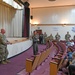 U.S. Air Force Colonel Adam Gaudinski, 173rd Maintenance Group commander, addresses personnel before they depart on a deployment to Kadena Air Base, Japan.