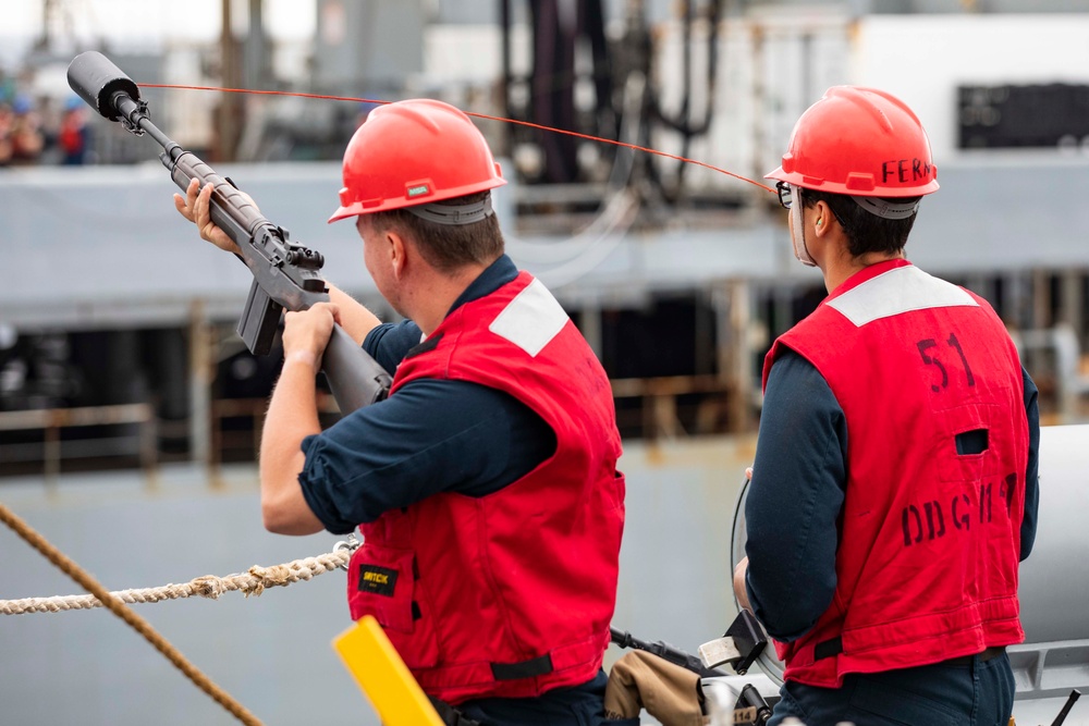 USS Ralph Johnson conducts RAS with USNS Tippecanoe.