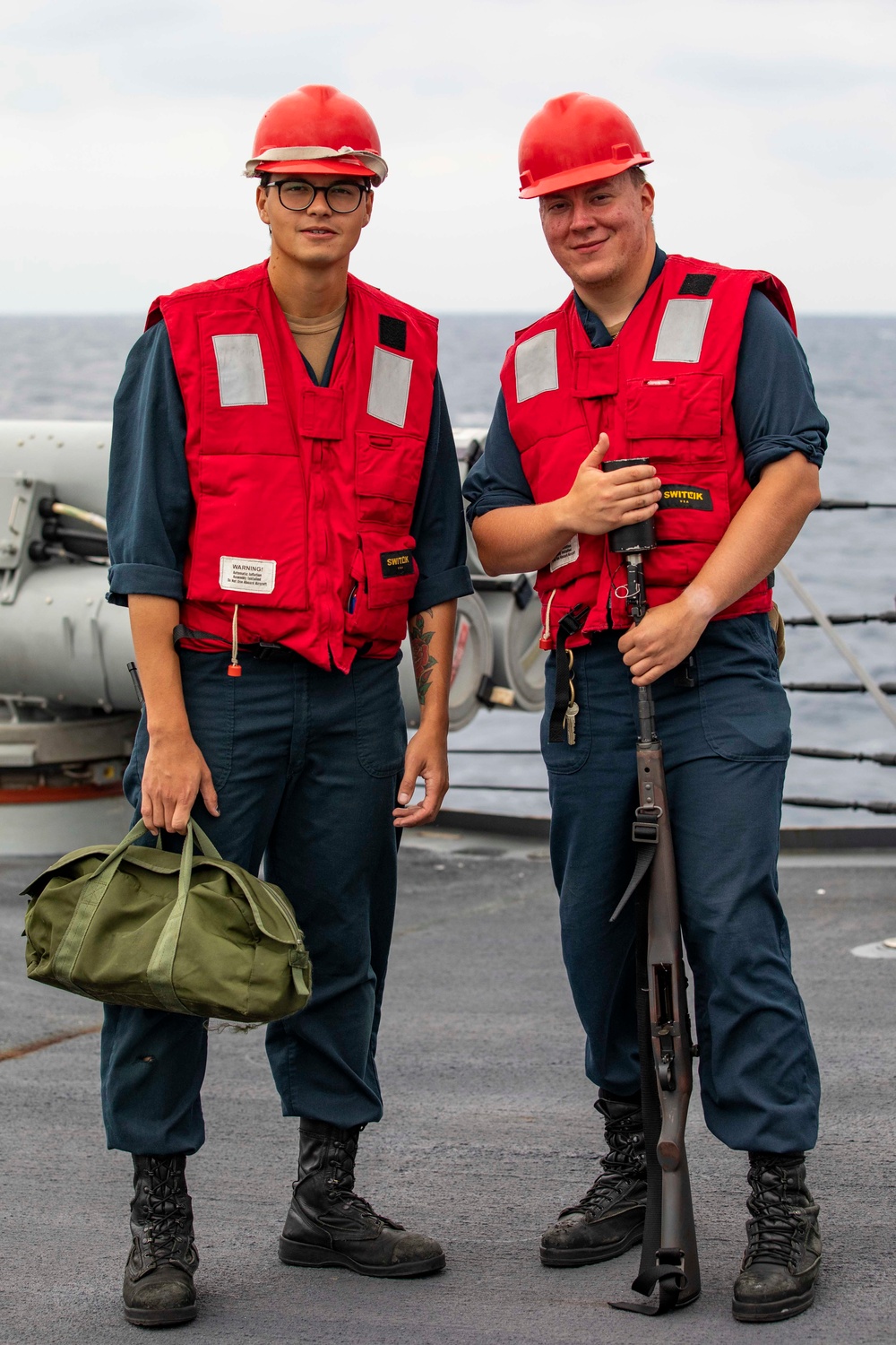 USS Ralph Johnson conducts RAS with USNS Tippecanoe.