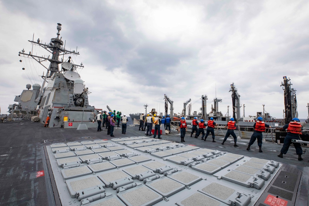 USS Ralph Johnson conducts RAS with USNS Tippecanoe.