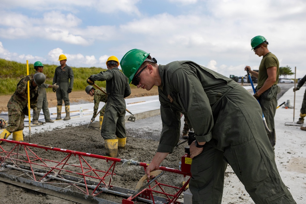 All in a day's work - Japan Ground Self-Defense Force, U.S. Marines, and Sailors prepare Kirishima Training Area for airfield damage repair training